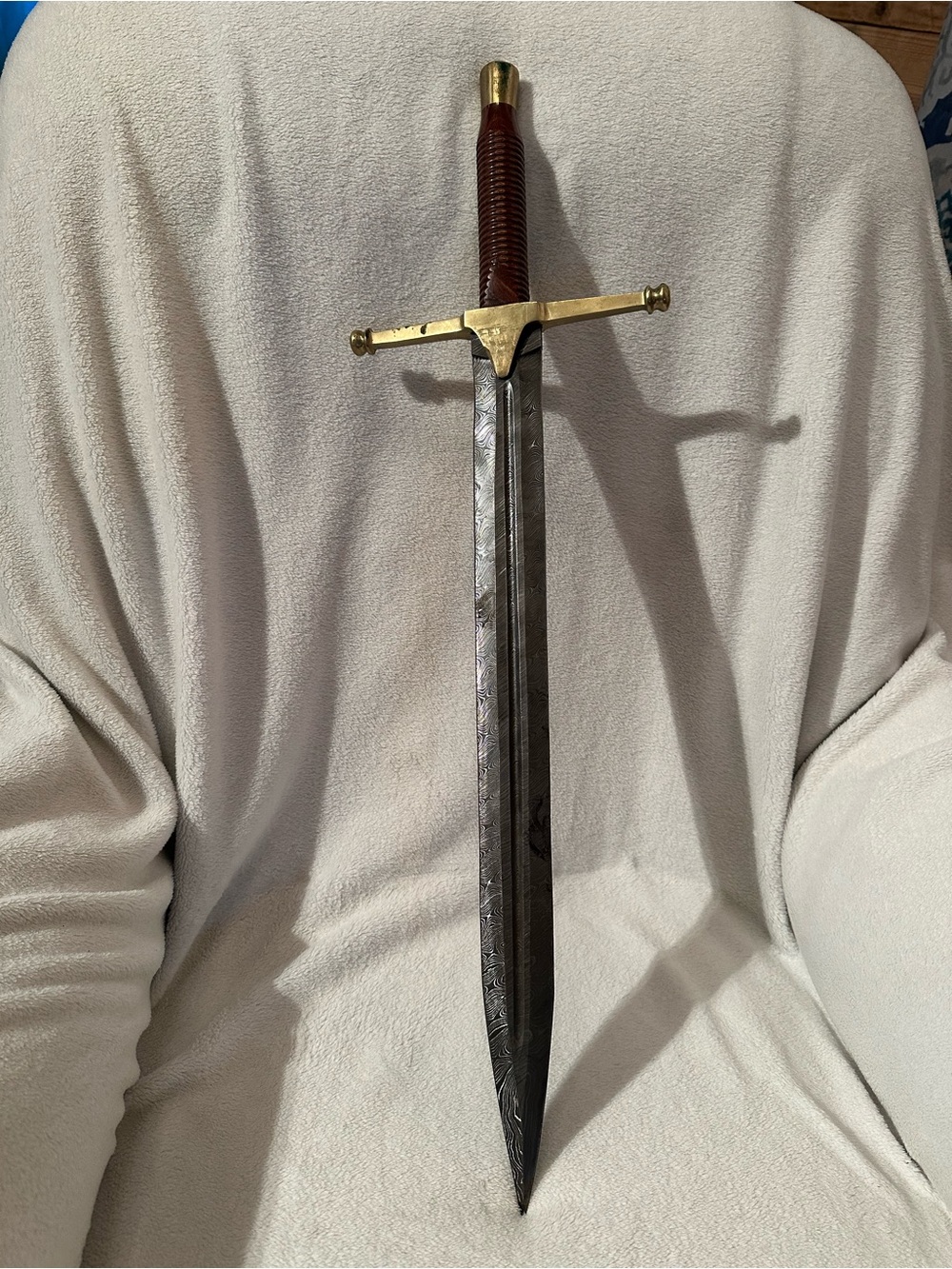 Damascus Rhindon Sword. Comes with yellow sheath.